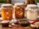 fermentacja w domowej kuchni z kiszoną marchewką kimchi i zakwasem w szklanych słoikach na drewnianym stole